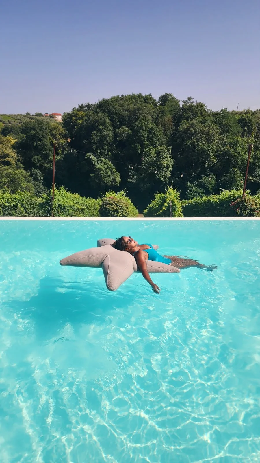 relaxing in an infinite pool in Italy