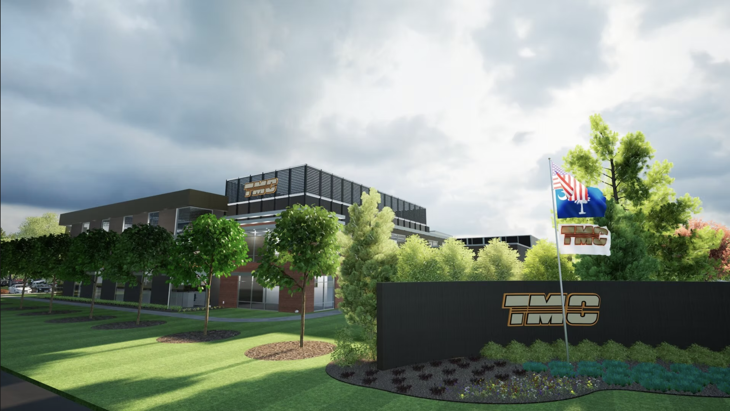 A modern building with the logo TMC, surrounded by trees and greenery, with flags displaying the TMC logo and an American flag, underneath a cloudy sky.