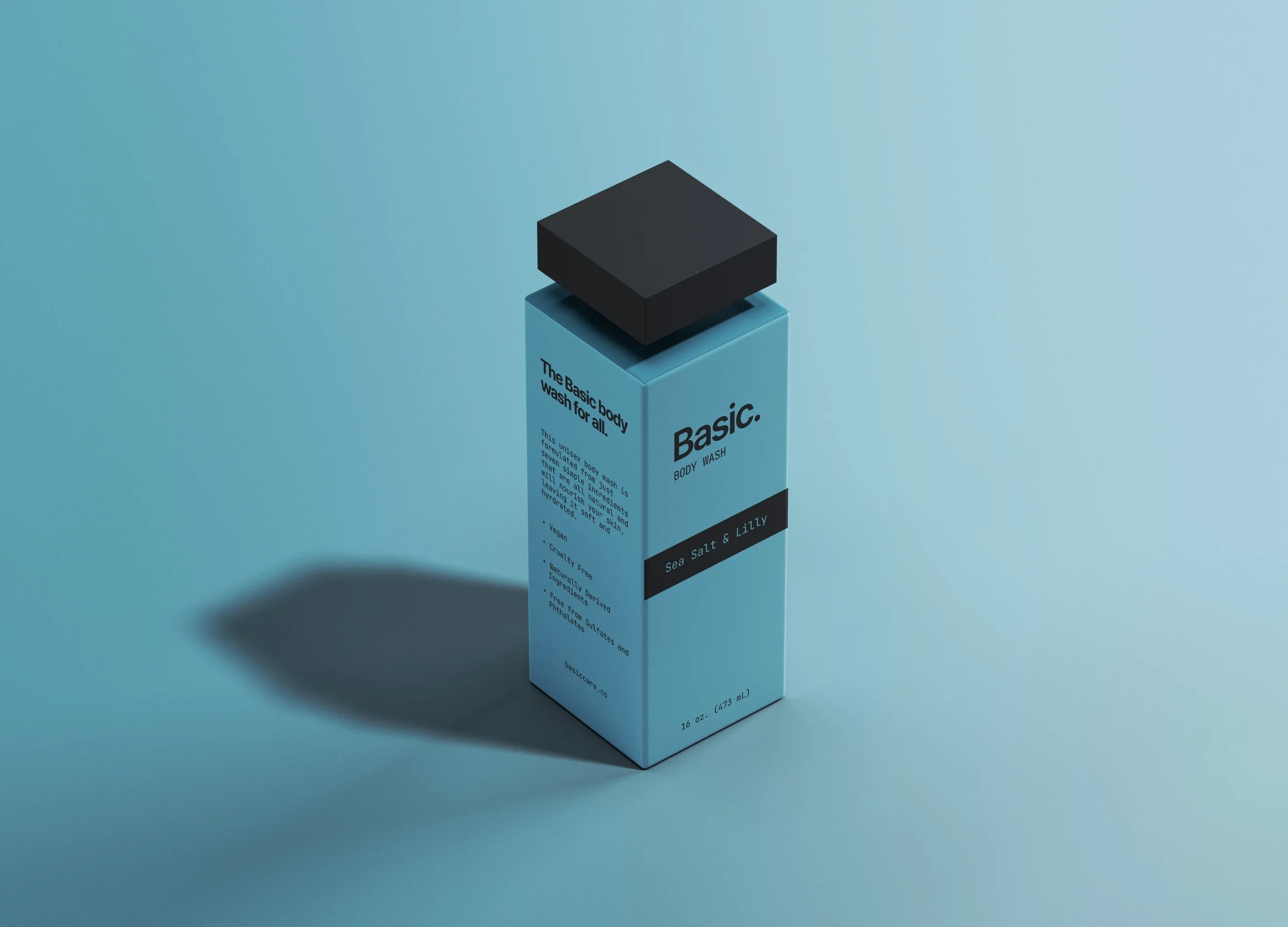 A light blue boxy bottle of body wash with black cap, labeled "Basic. Body Wash," and description text, standing on a matching light blue surface with a dark shadow behind it.