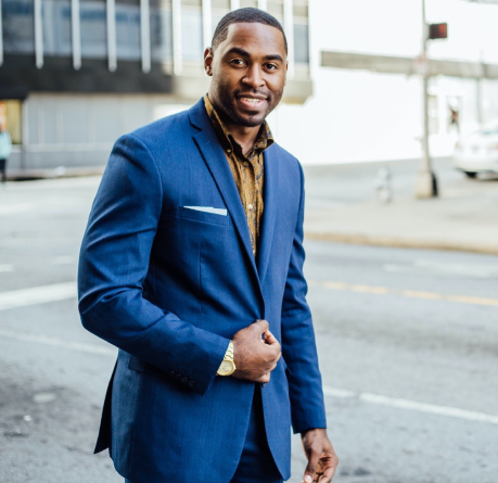A Man in a Suit Smiling