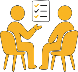Two people sitting and talking in a meeting, with a checklist or presentation board on the wall.