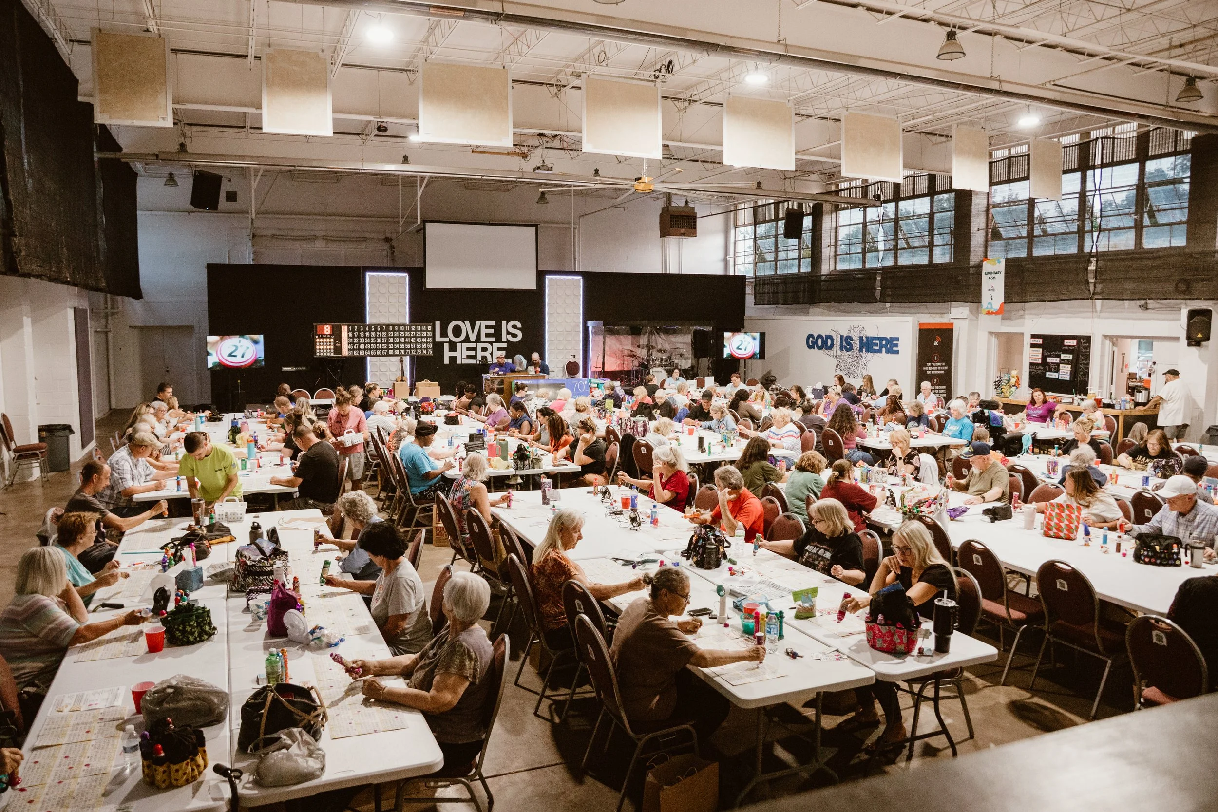 Neighbors gathered around tables at Altered Church’s community meal