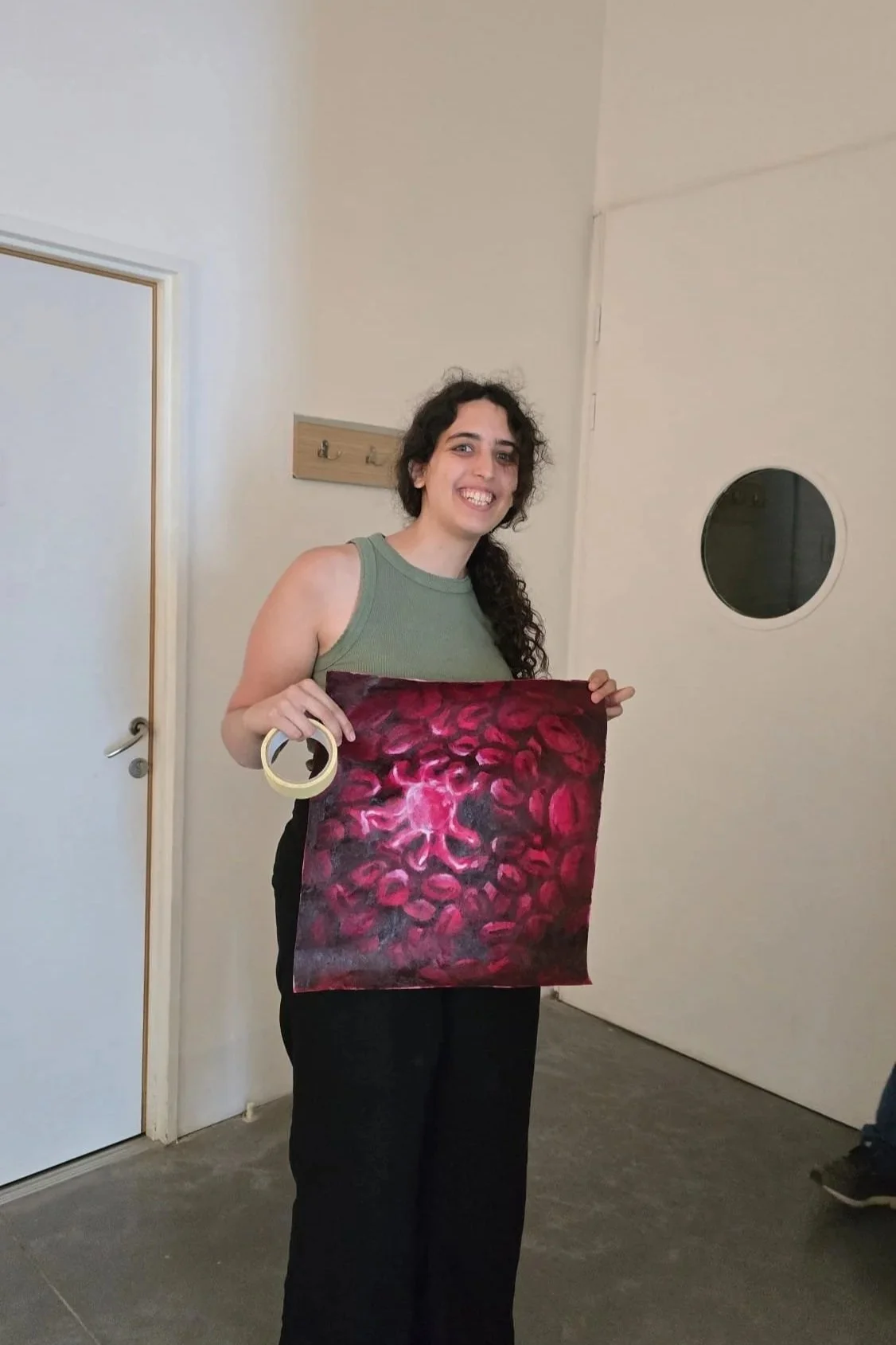 Hanging up the artwork in the museum.