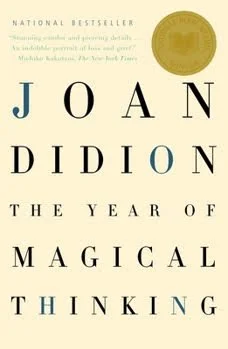 Book cover of Joan Didion's The Year of Magical Thinking with National Bestseller text and a gold award seal.