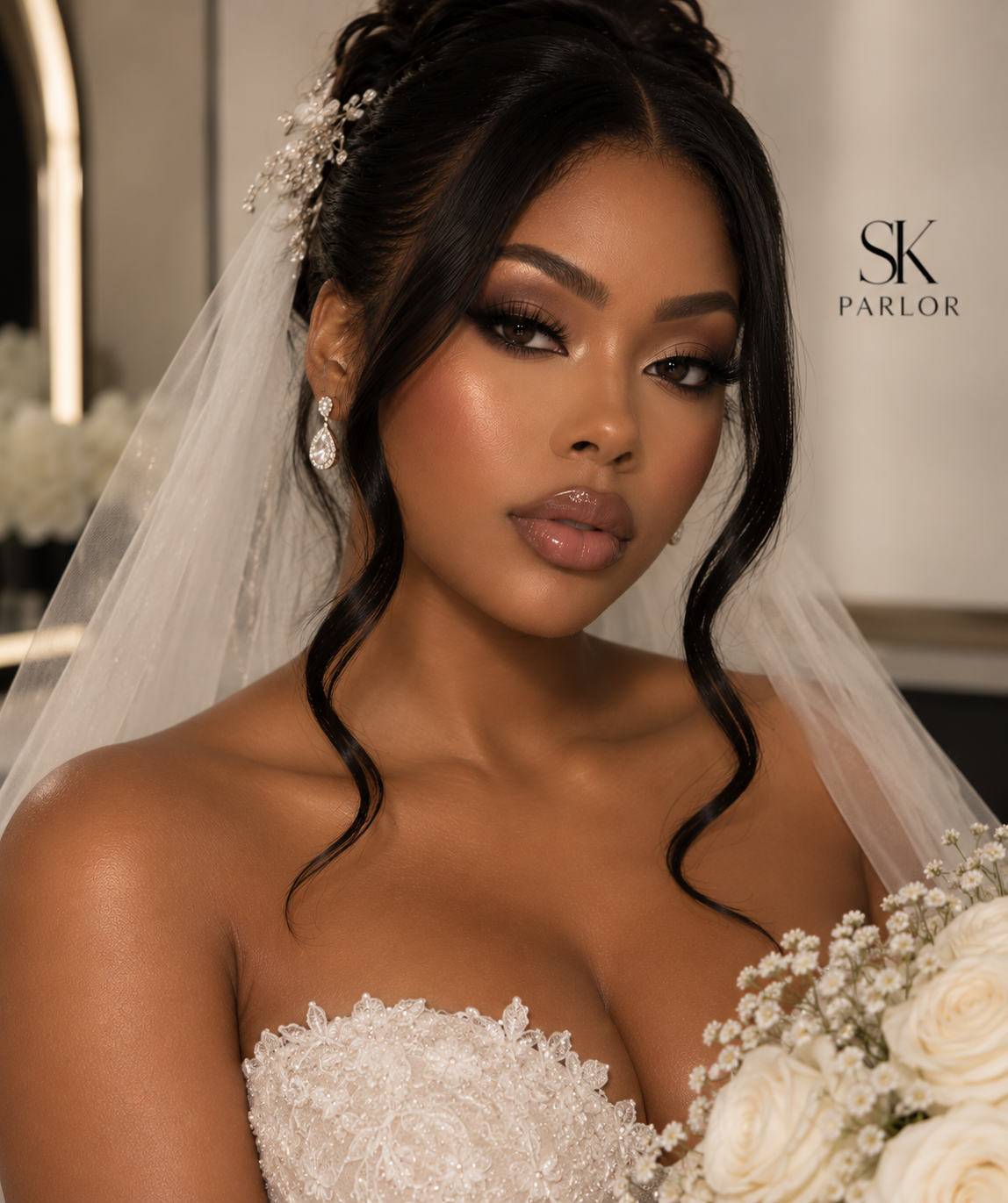 A woman in bridal makeup and jewelry, wearing a wedding dress and veil, holding a bouquet of white flowers, with the 'SK Parlor' logo in the background.