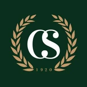 Logo with the letters 'CS' surrounded by a gold laurel wreath and the year '1920' at the bottom, on a dark green background.