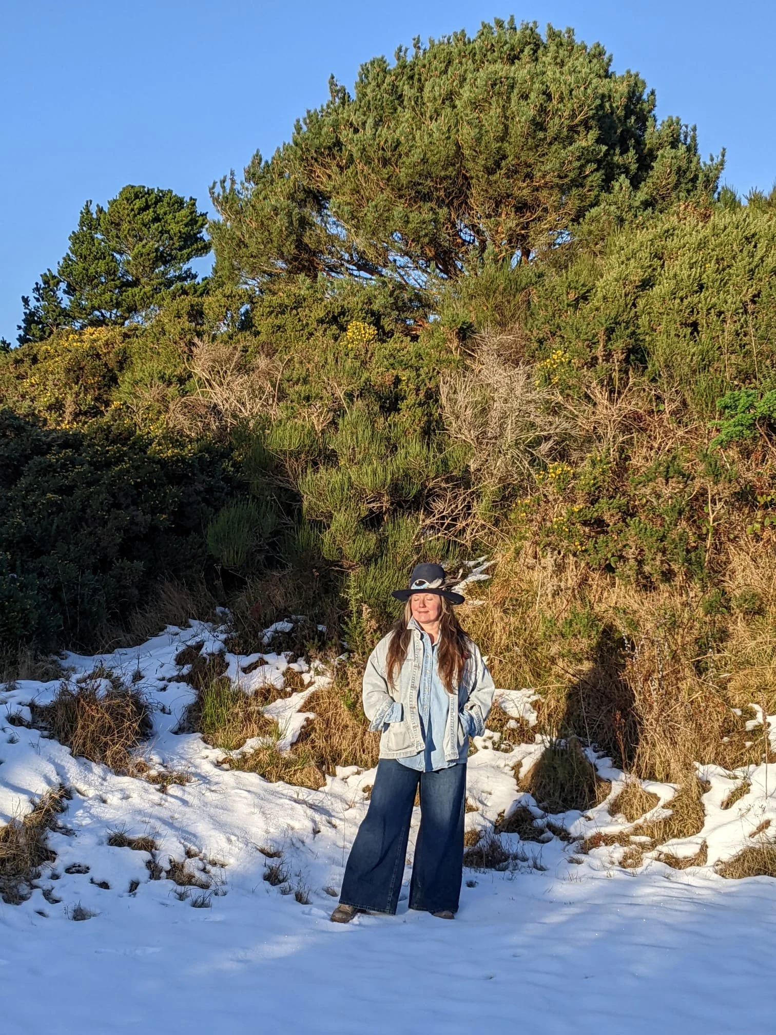 Rev. Bunny Love-Schock standing in the snow and sunshine