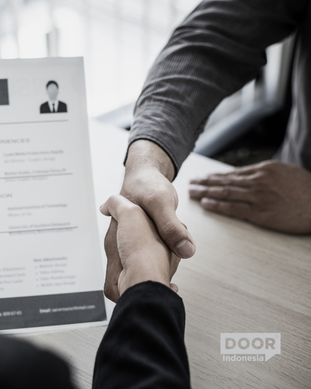 A shot of interviewer and candidate shaking hands