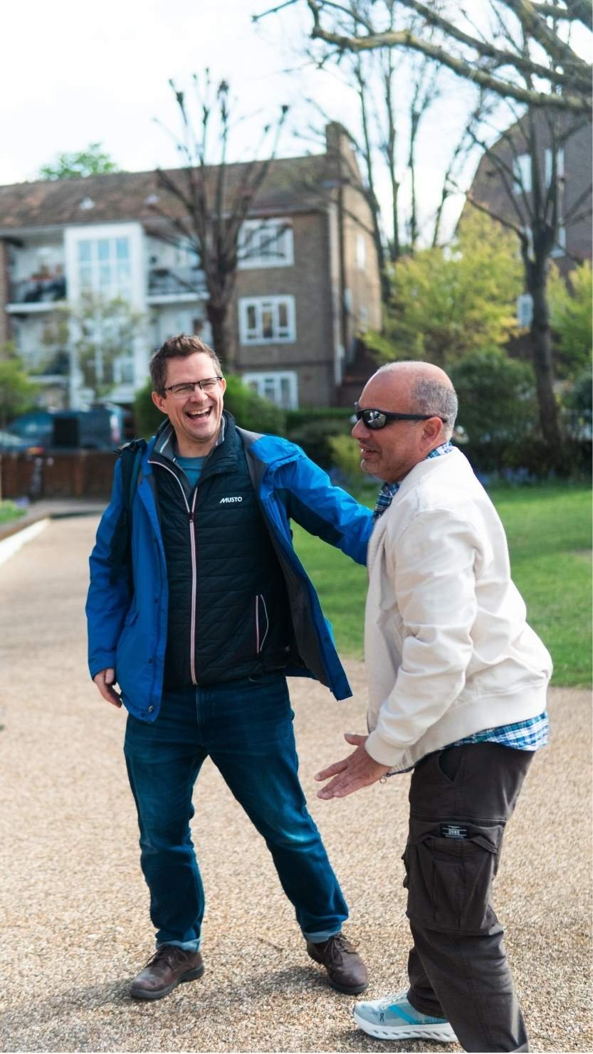 men laughing outside church