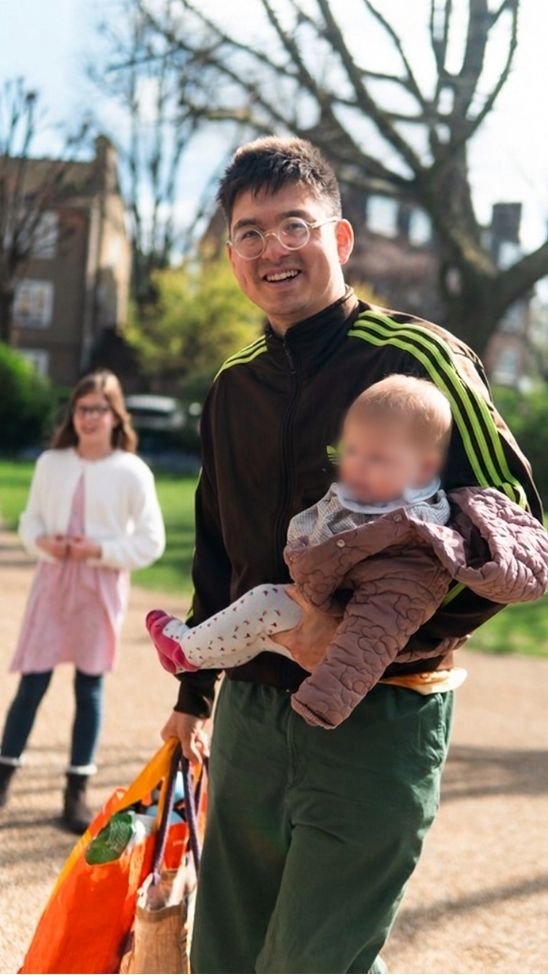 Man carrying baby to church