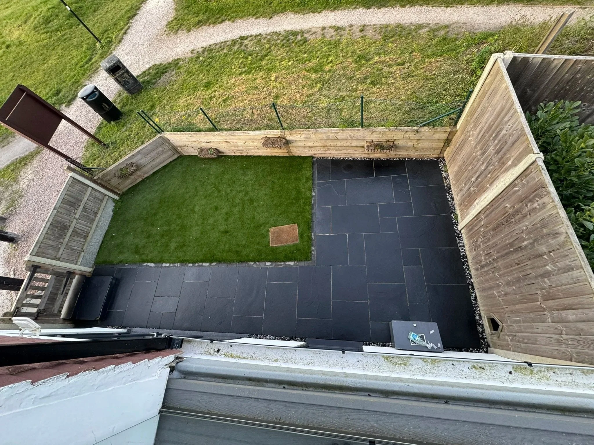 Exterior slate patio after deep cleaning, sealer removal and professional resealing, showing restored colour and a uniform protected finish.