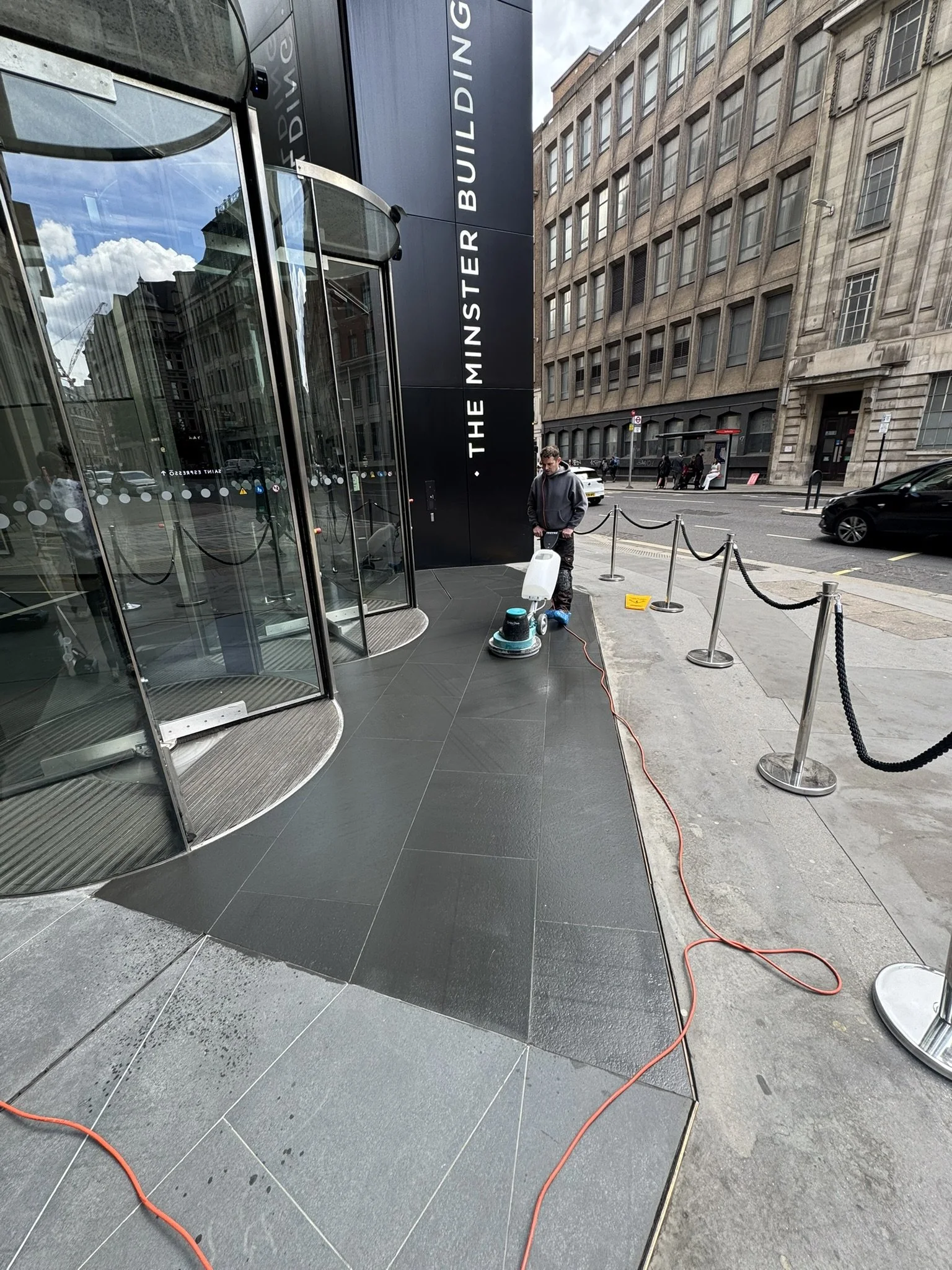 Commercial limestone cleaning and resealing at The Minster Building in London using specialist natural stone care methods.