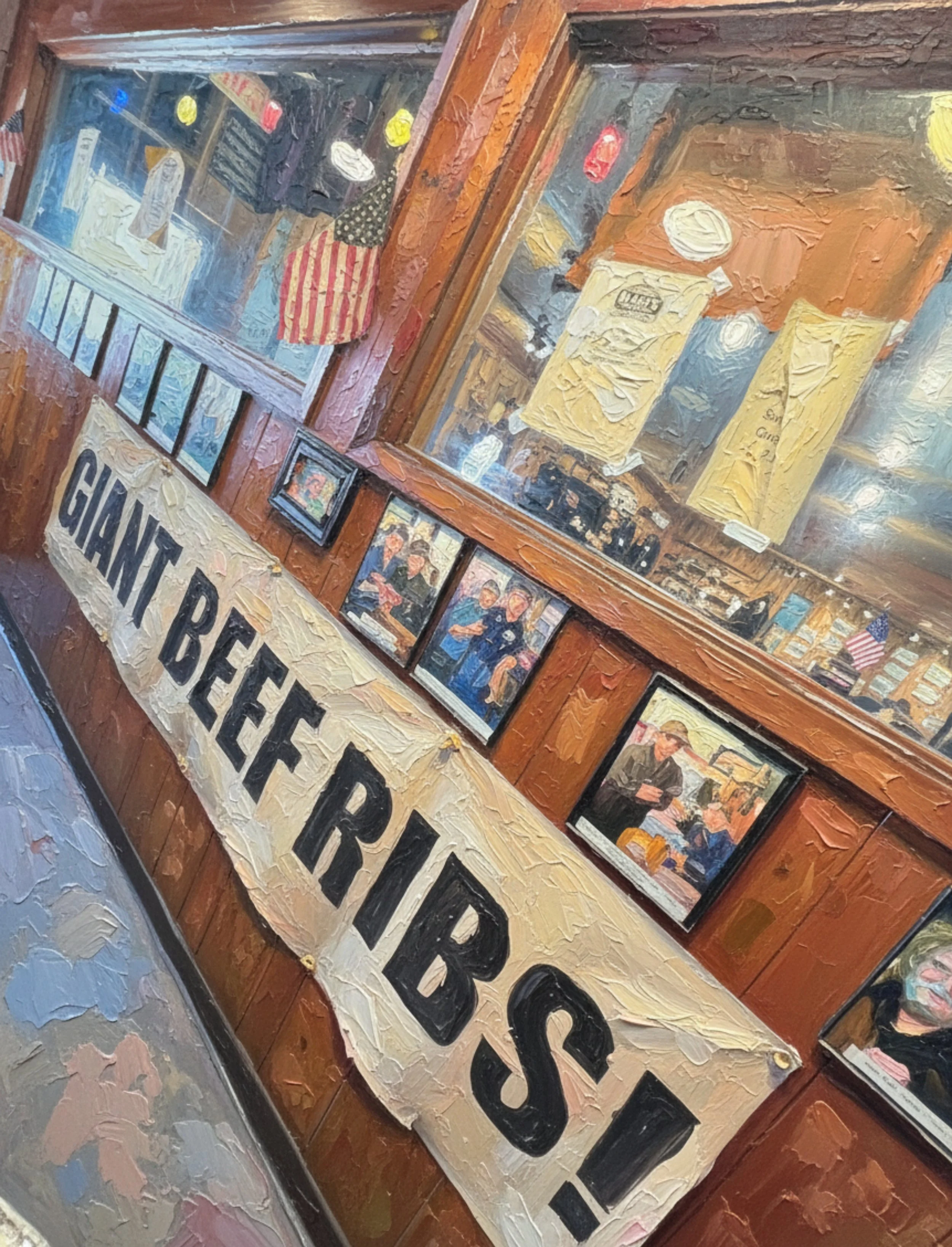 Black's Original 'GIANT BEEF RIBS' on SIGN, with various framed pictures and posters on the wooden wall, including one of a woman and multiple small American flags. The scene is viewed through a window with reflections.