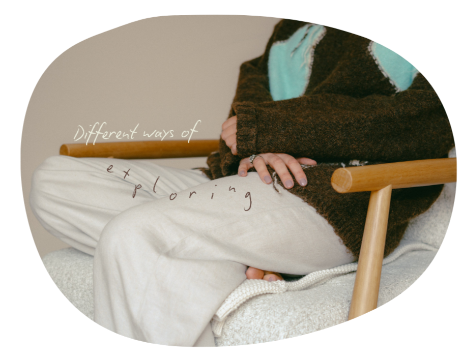 Person wearing a brown sweater and light-colored pants sitting on a chair, with words 'Different ways of exploring' written on the image.
