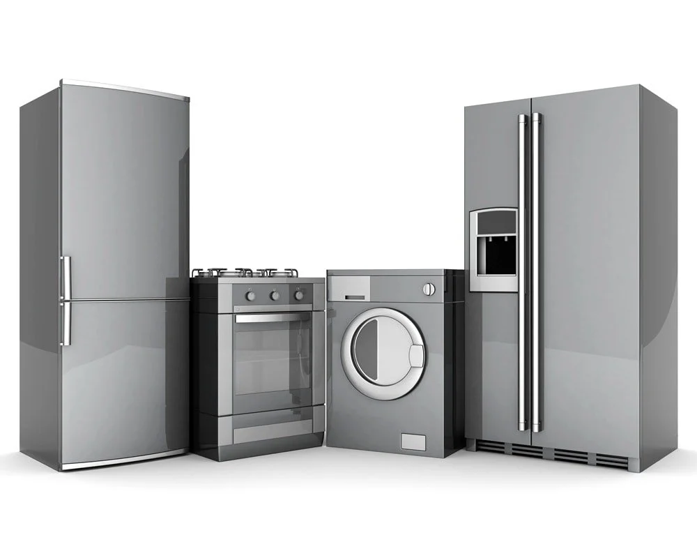 Silver kitchen appliances including a refrigerator, oven, washing machine, and freezer, arranged from left to right.