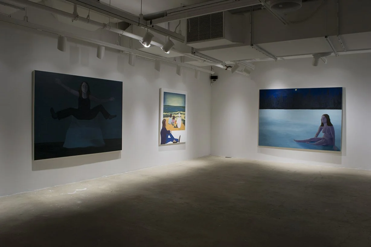 Art show with painting of naked woman, painting of falling woman, and painting of woman looking out window