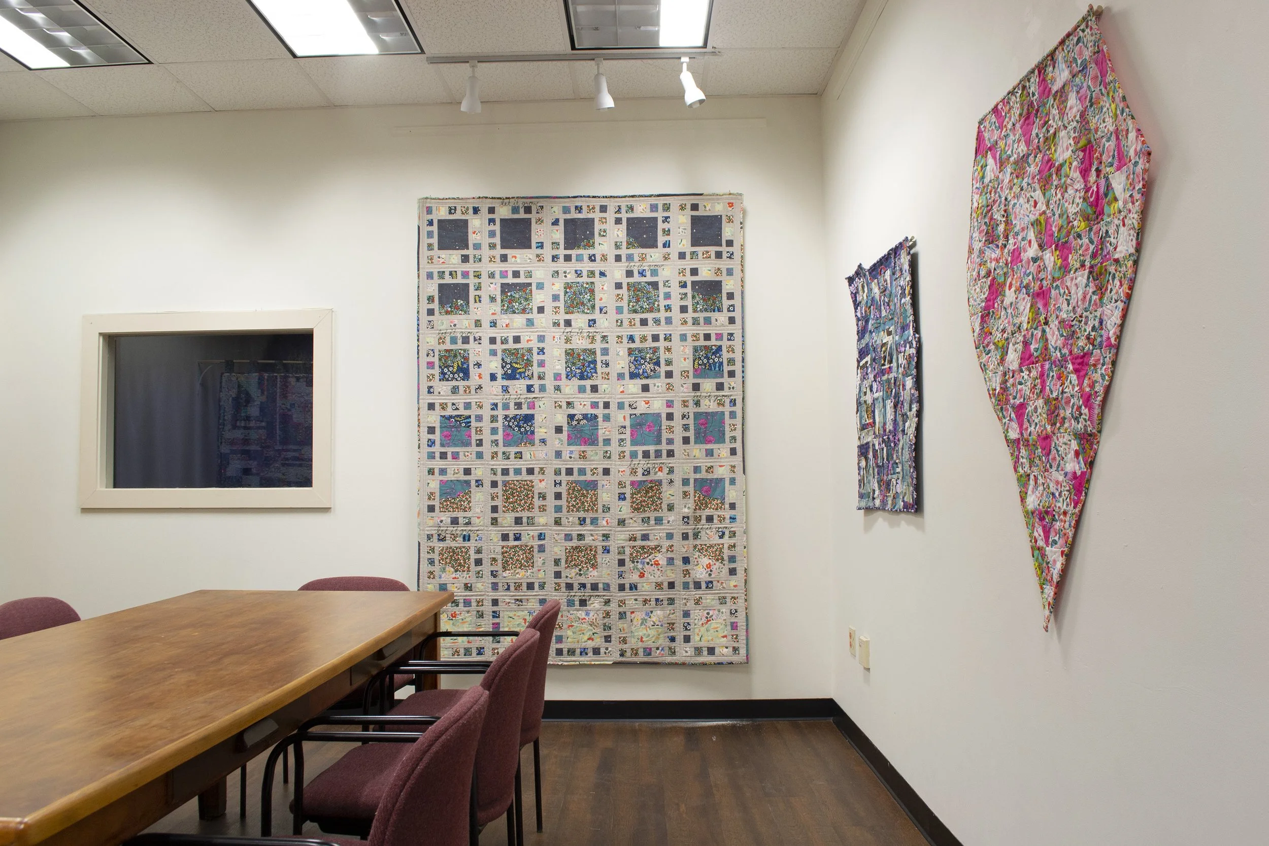 Installation view of back wall of main room of art show "Polychroma"