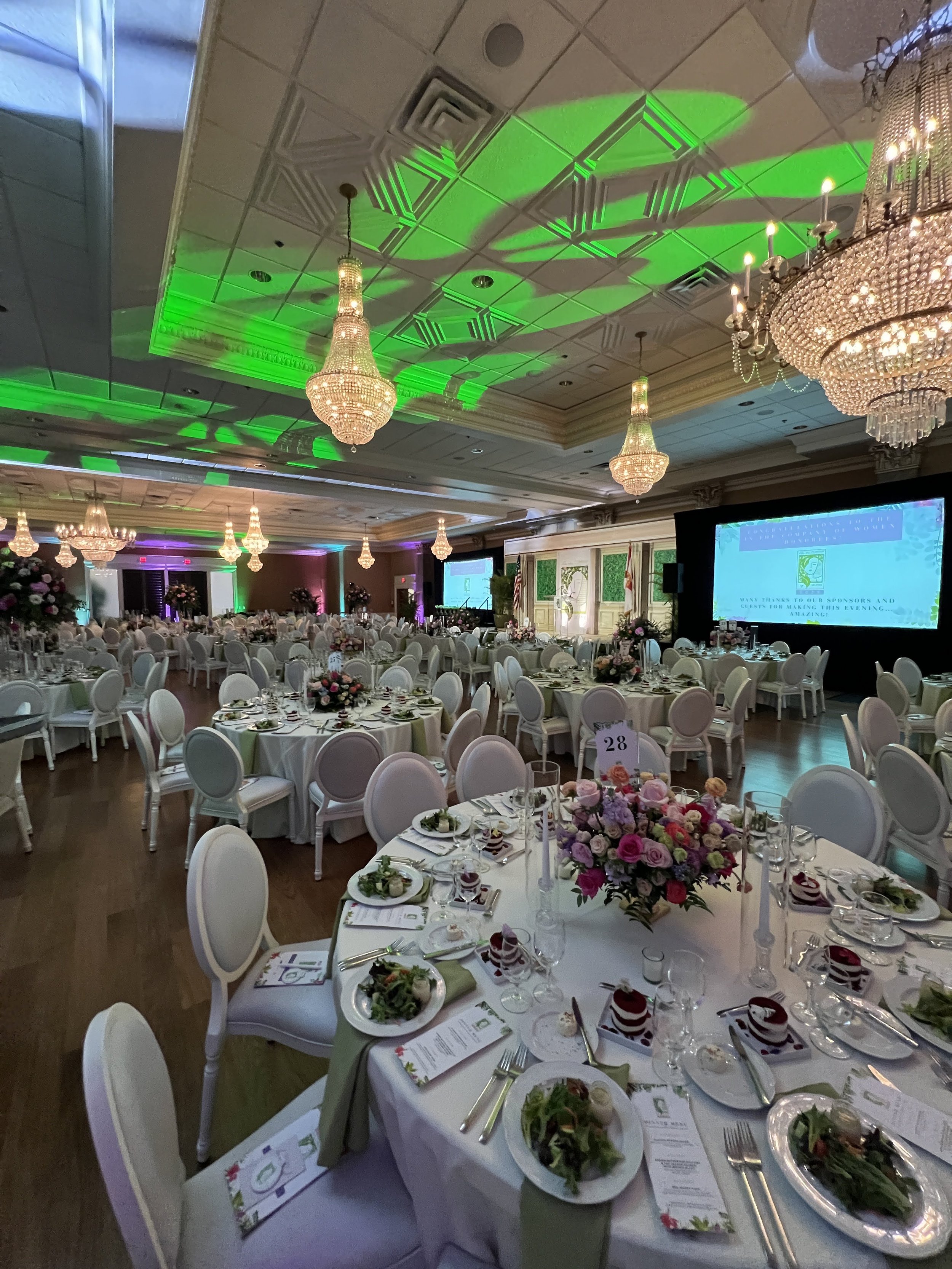 Ballroom gala with green and pink ambient uplighting in Southwest Florida