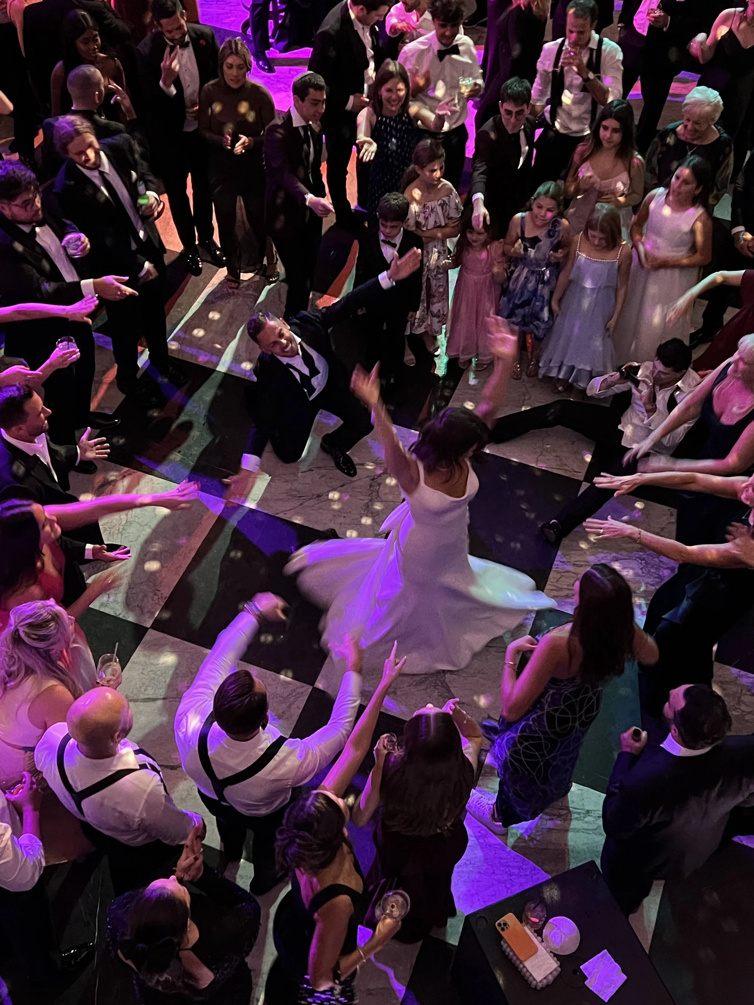 Dance floor with pattern light projection and dancing guests in Sarasota