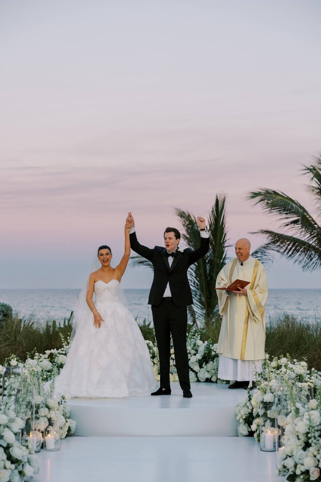 Beach wedding ceremony at sunset with officiant and ocean backdrop in Sarasota