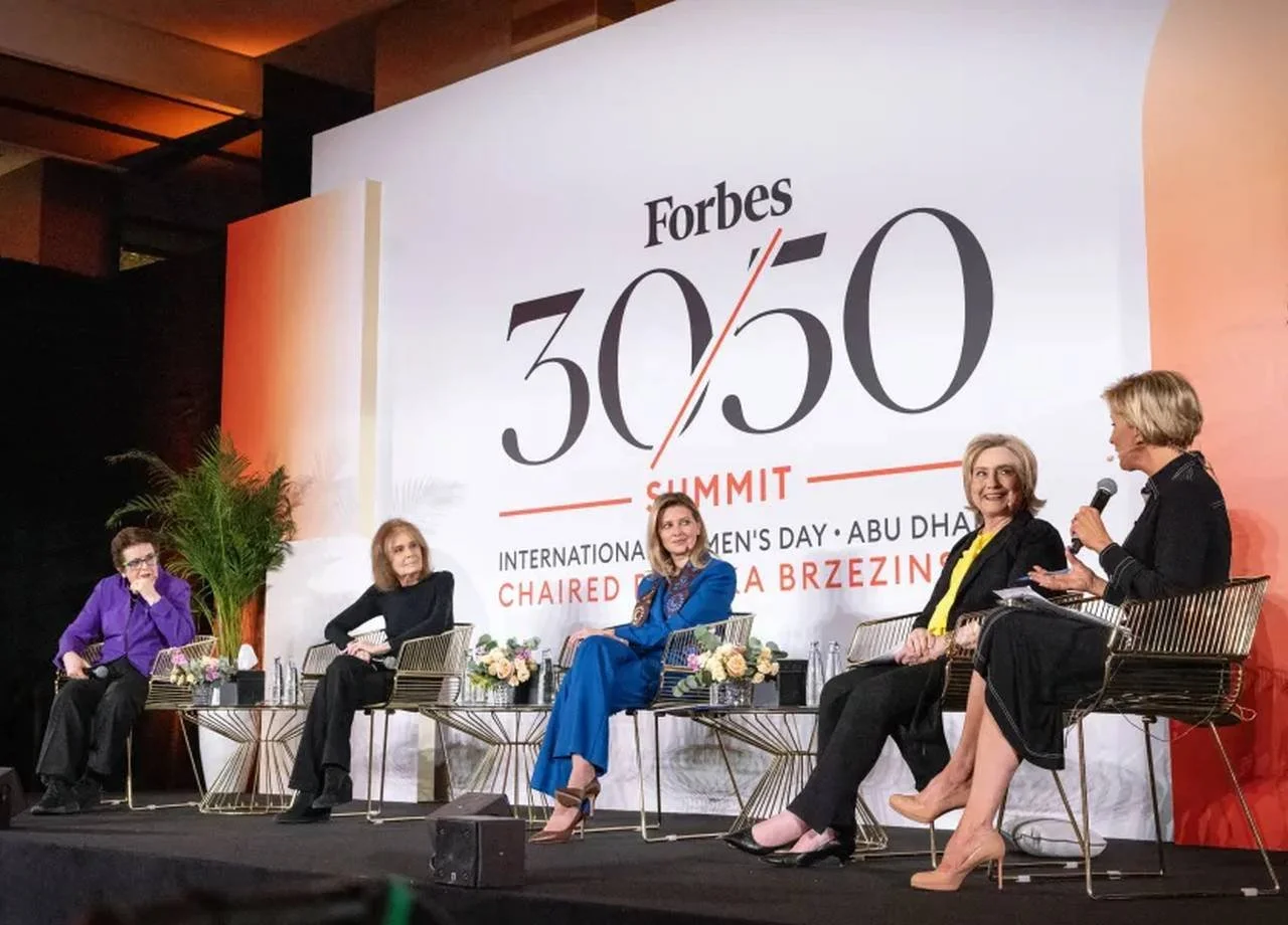 Five women seated onstage during a panel discussion at the Forbes 30/50 Summit in Abu Dhabi.