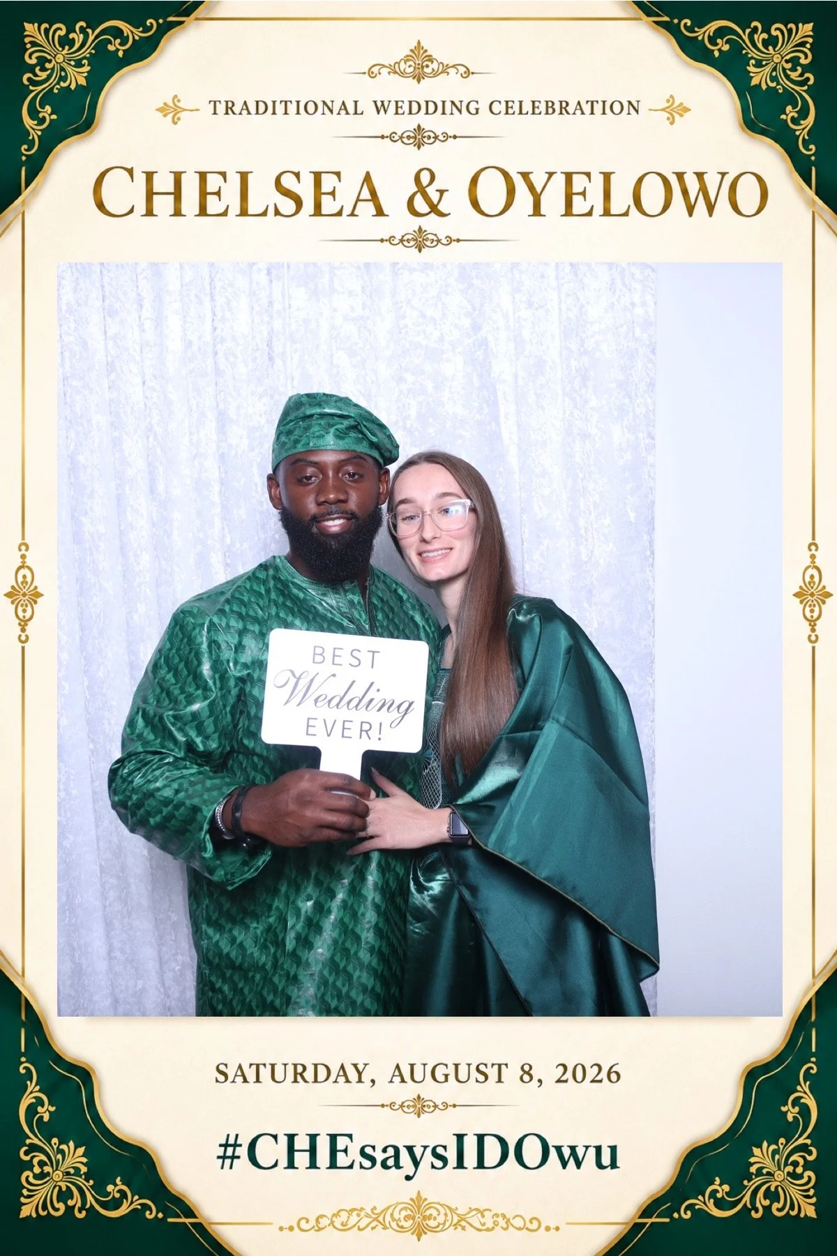 A couple dressed in green traditional attire during a wedding celebration, standing in front of a decorated backdrop. The man holds a sign that reads 'Best Wedding Ever!'. The event date, Saturday, August 8, 2026, and hashtag #CHEsaysIDowu are visible on the display.