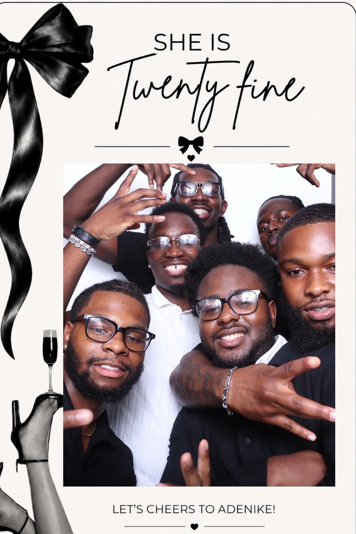 A group of six smiling men taking a selfie, some making hand gestures, at a celebration. The image is part of a greeting card with text that reads, "She is twenty fine" and "Let's cheers to Adenike!" with decorative black ribbons and champagne glasses.