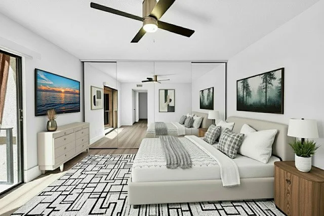 Bright modern bedroom with a large white bed, patterned decor, and framed nature photos on the walls.