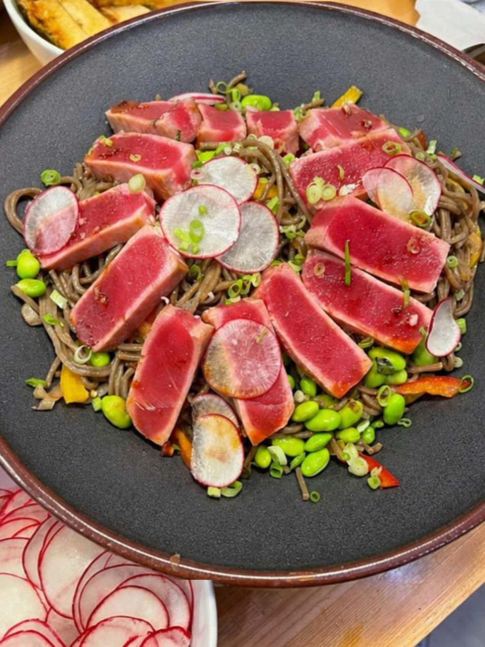 Seared ahi tuna over sesame soba noodles with radish and edamame, a private chef dinner for a Revelstoke ski holiday.