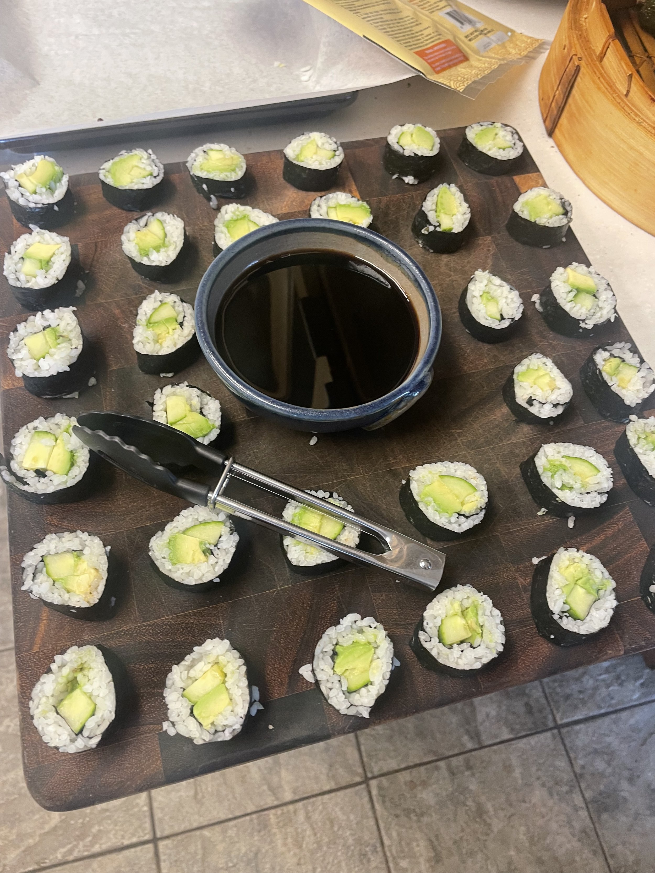 Hand-rolled avocado sushi with soy sauce, catering for a Revelstoke ski holiday.