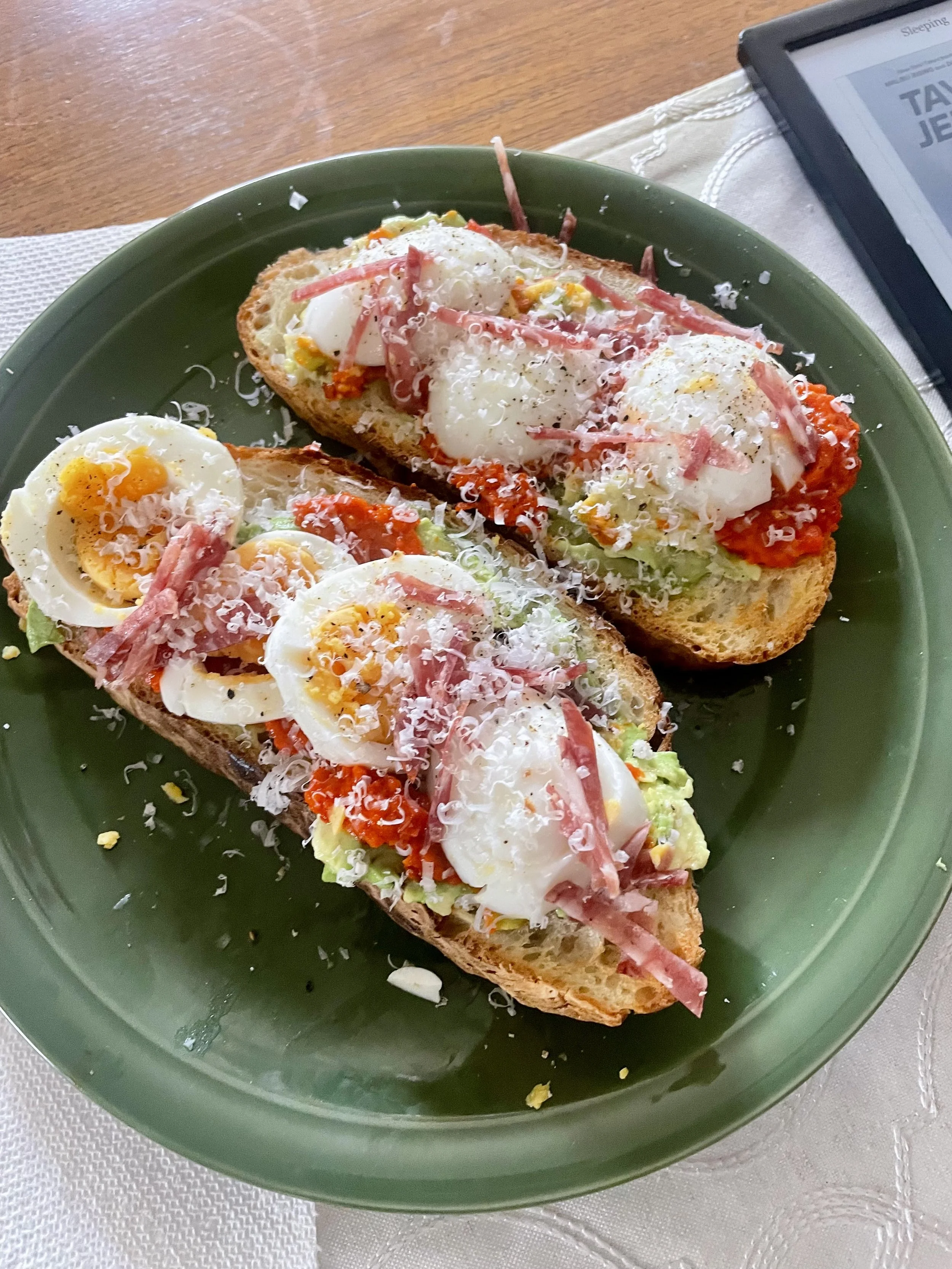 Open-faced toasts with soft-boiled egg, cured meat and avocado, a ski trip breakfast by a private chef in Revelstoke.