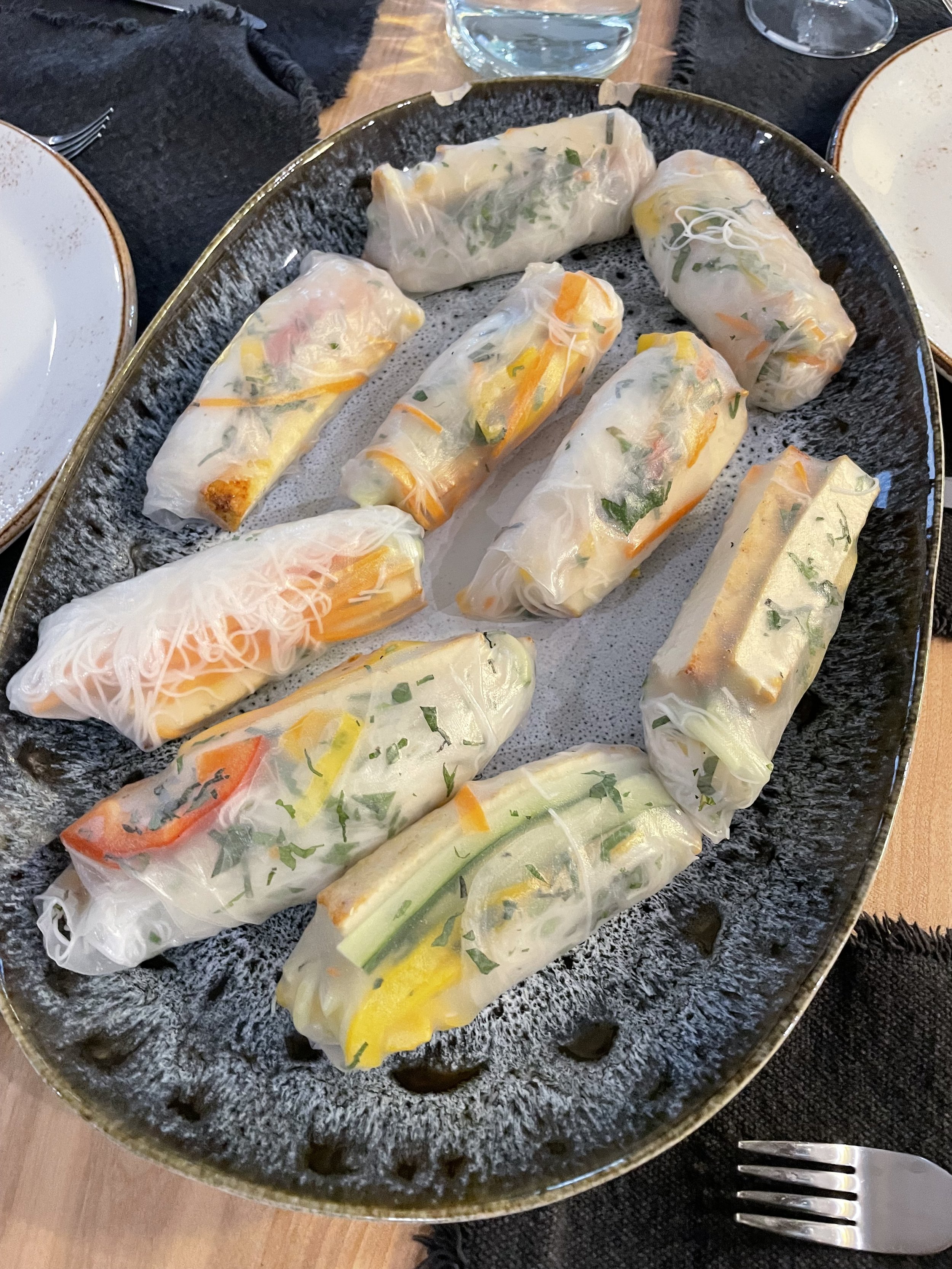 Fresh rice paper summer rolls with colourful vegetables, a light appetizer from a Revelstoke private chef.