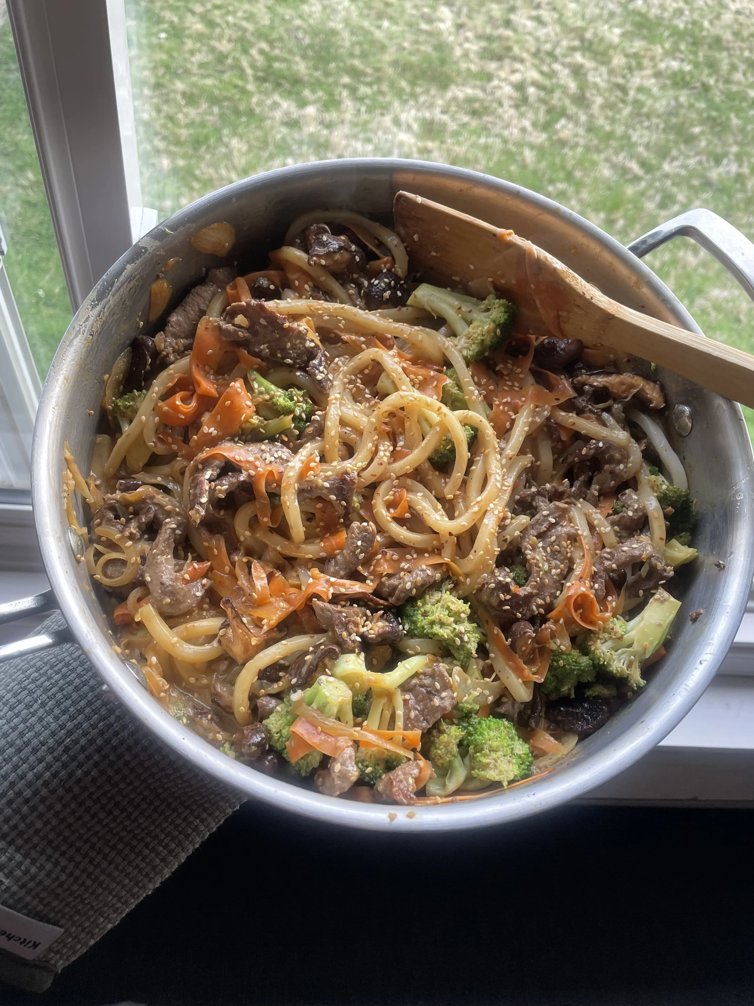 Beef and vegetable noodle stir-fry, a comfort dinner for a Revelstoke ski holiday group.