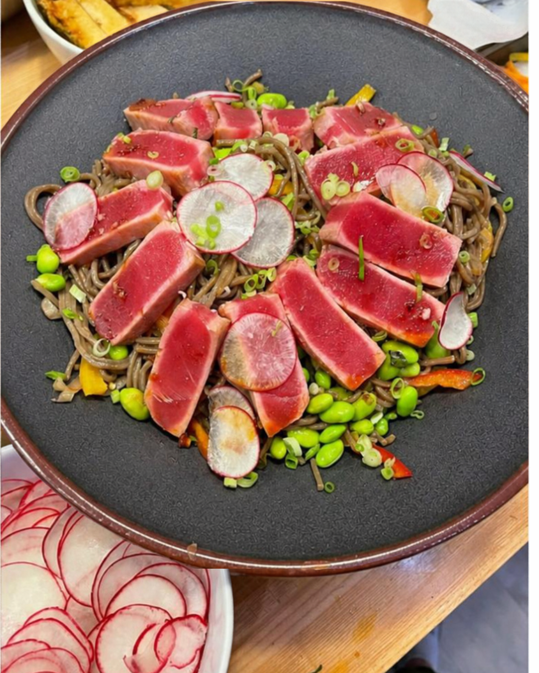 Seared ahi tuna over sesame soba noodles with radish and edamame, a private chef dinner for a Revelstoke ski holiday.