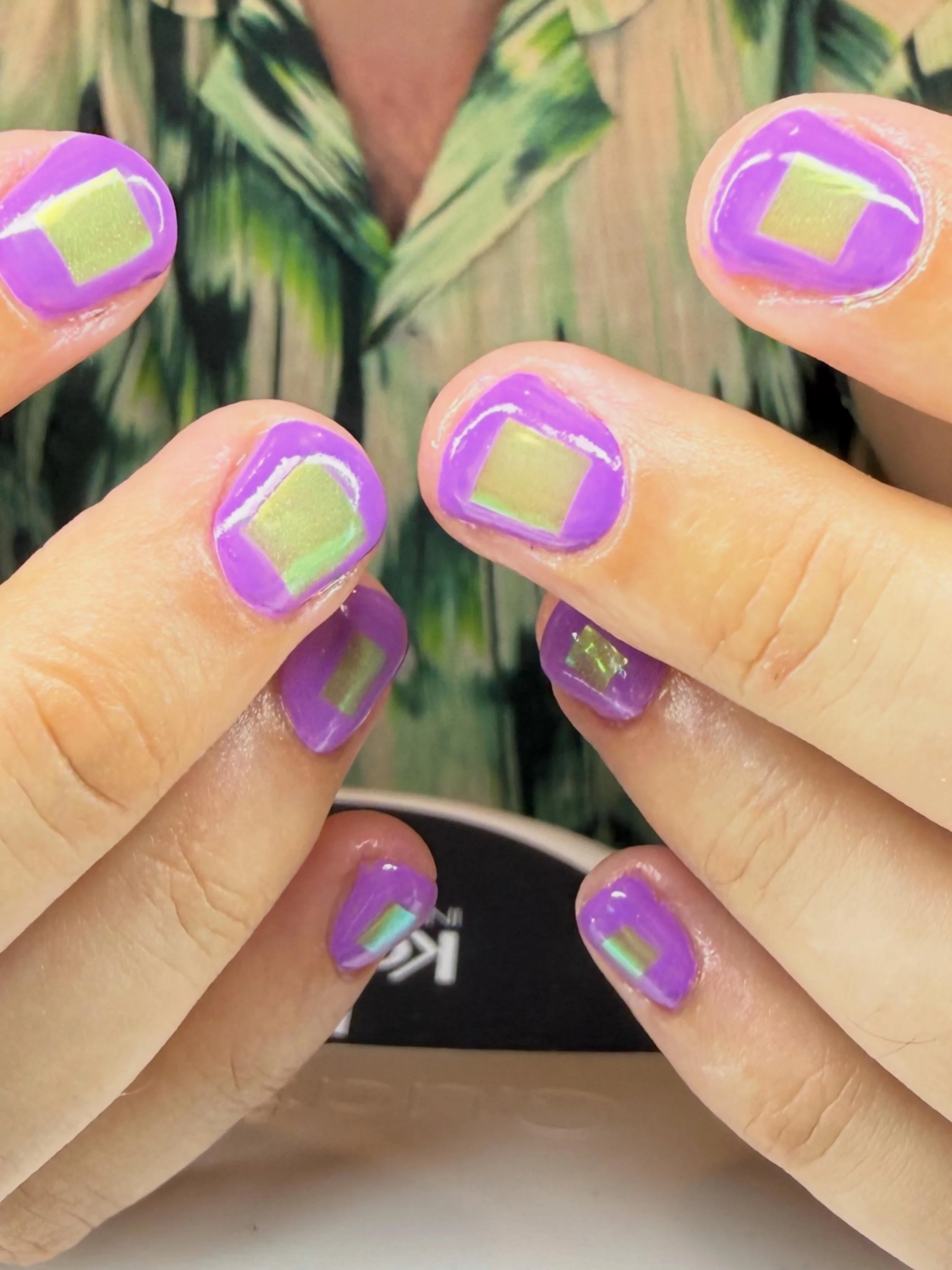 Purple geometric nail art with green chrome accents by Magpie Nail Collective in the San Francisco Bay Area