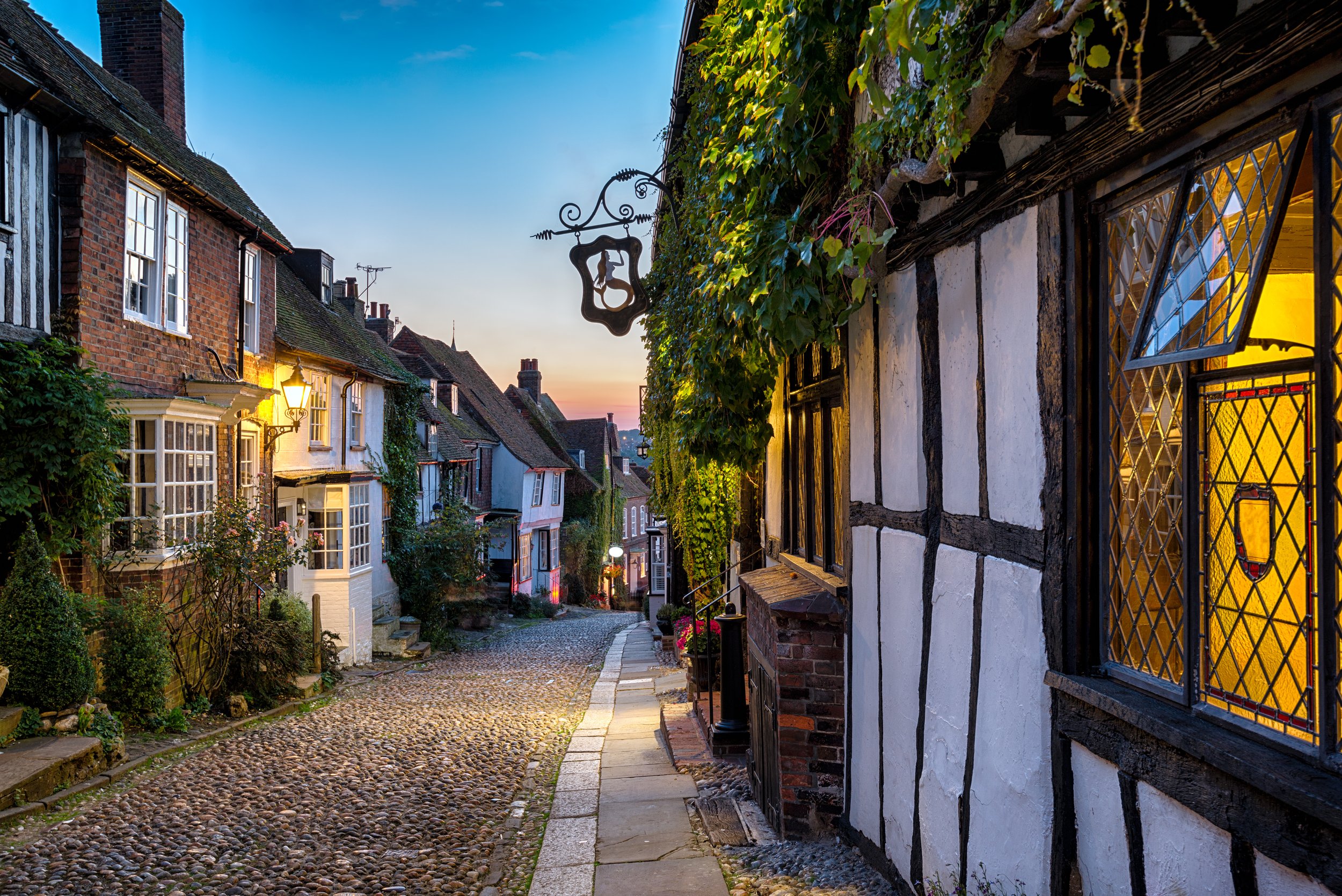Cosy cottages on Mermaid Street in the evening in Rye, East Sussex
