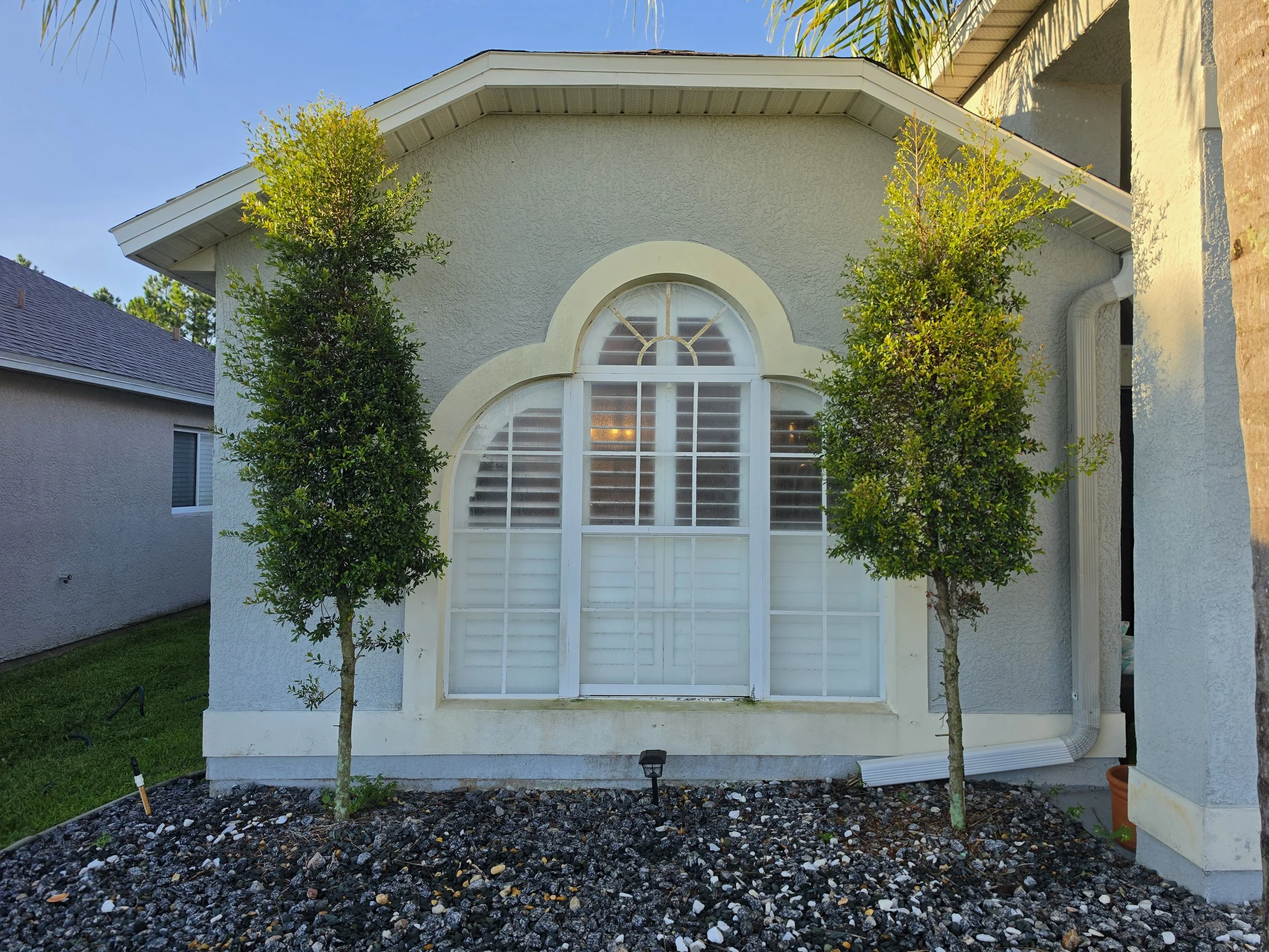Melbourne Florida home before soft washing by Station 321 Pressure & Soft Wash