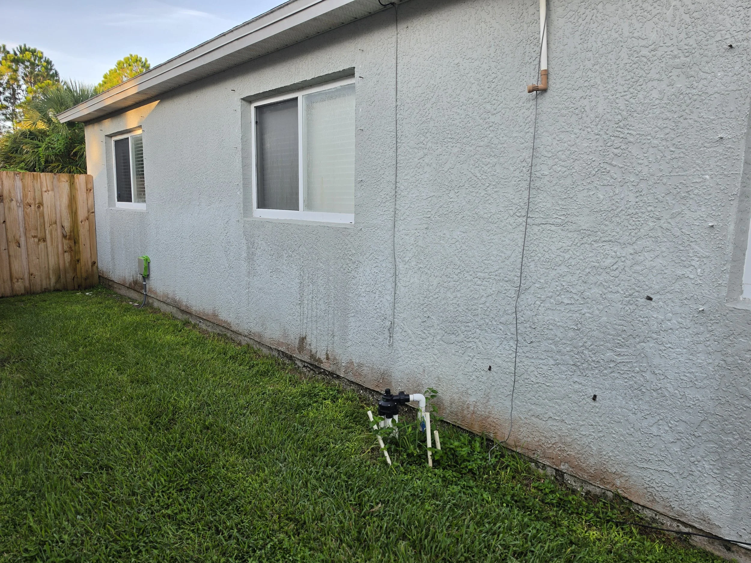 Melbourne Florida home before soft washing by Station 321 Pressure & Soft Wash