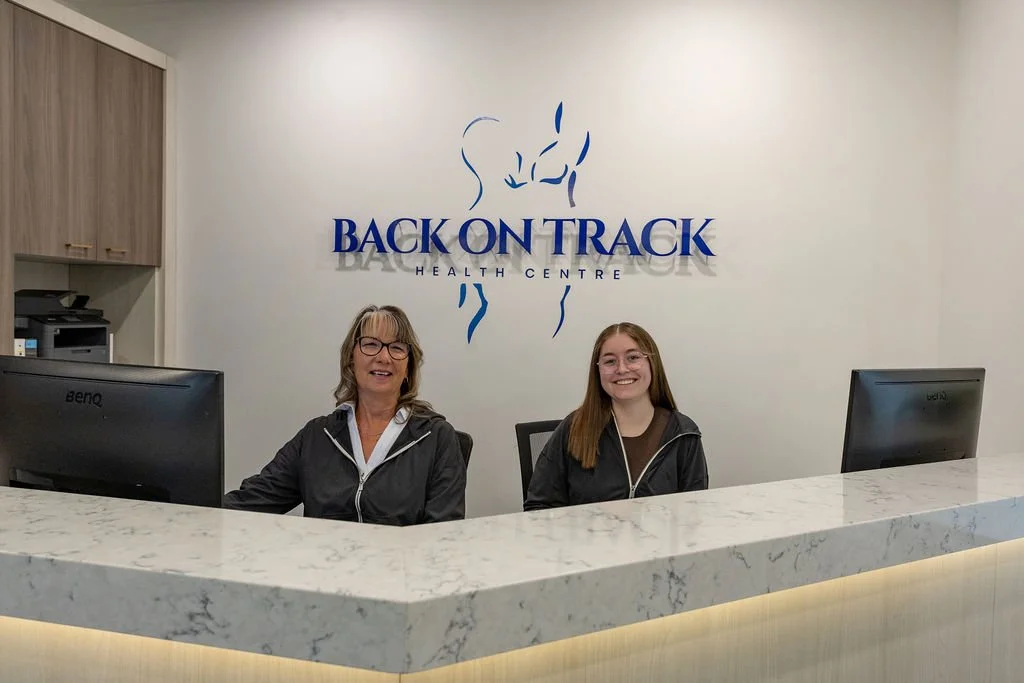 Back On Track Health Centre reception team at the front desk