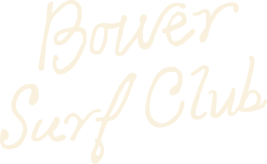 Handwritten text that says 'Bower Surf Club' on a black background.