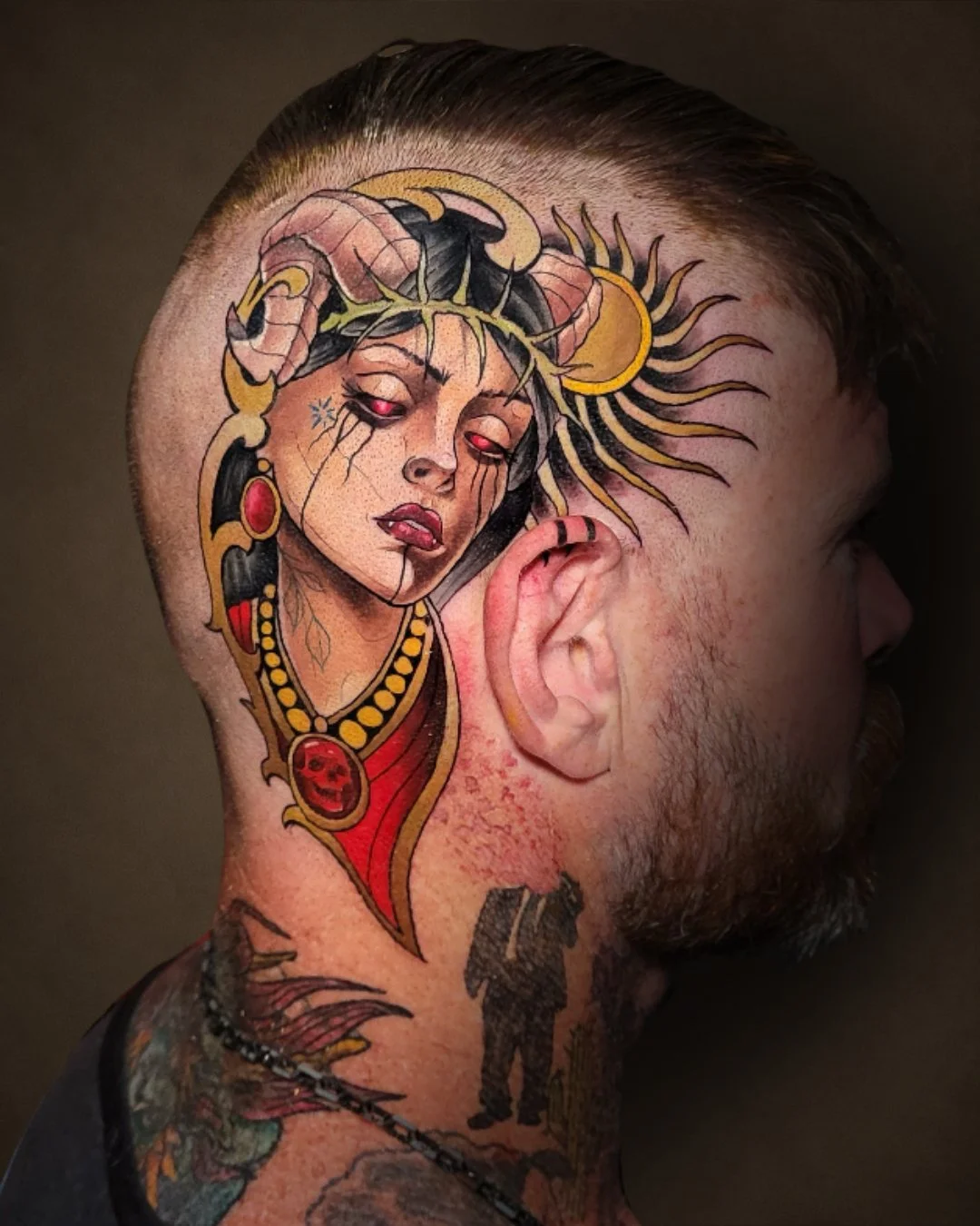 Color Neo-Traditional woman portrait tattoo with horns, tattooed on the side of the head.