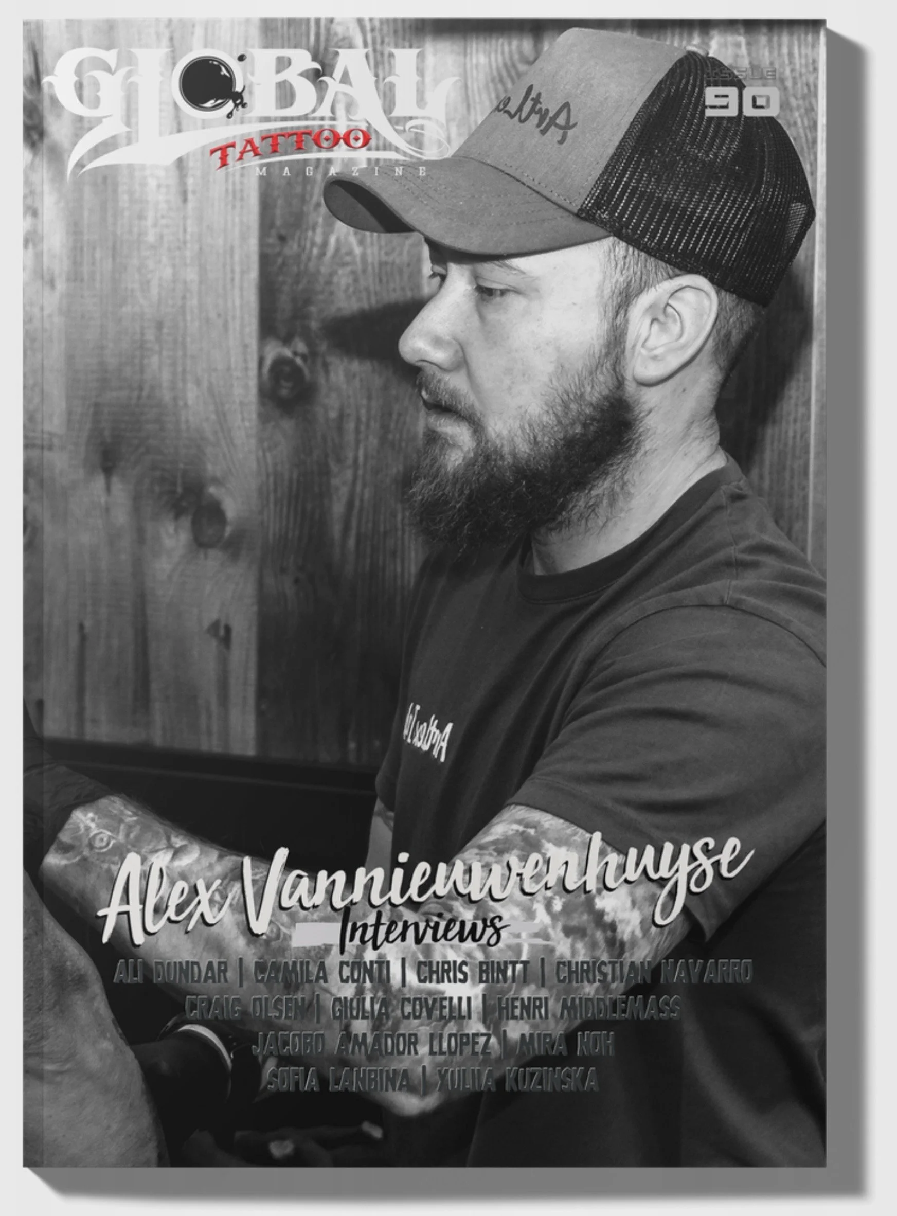 Black-and-white cover of Global Tattoo Magazine featuring a side profile of a young man wearing a trucker hat, with text announcing his name as Alex Vannieuwenhuise and noting his internship. The cover also lists several other names.