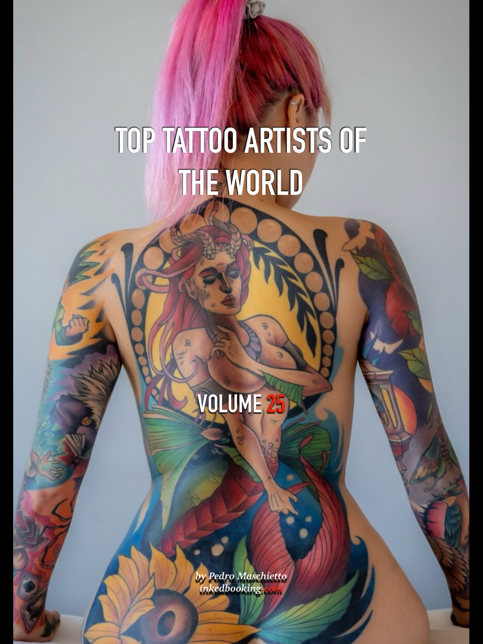 A person with vibrant pink hair and multiple tattoos covering their back, arms, and shoulders, portrayed in a studio setting with a plain background.
