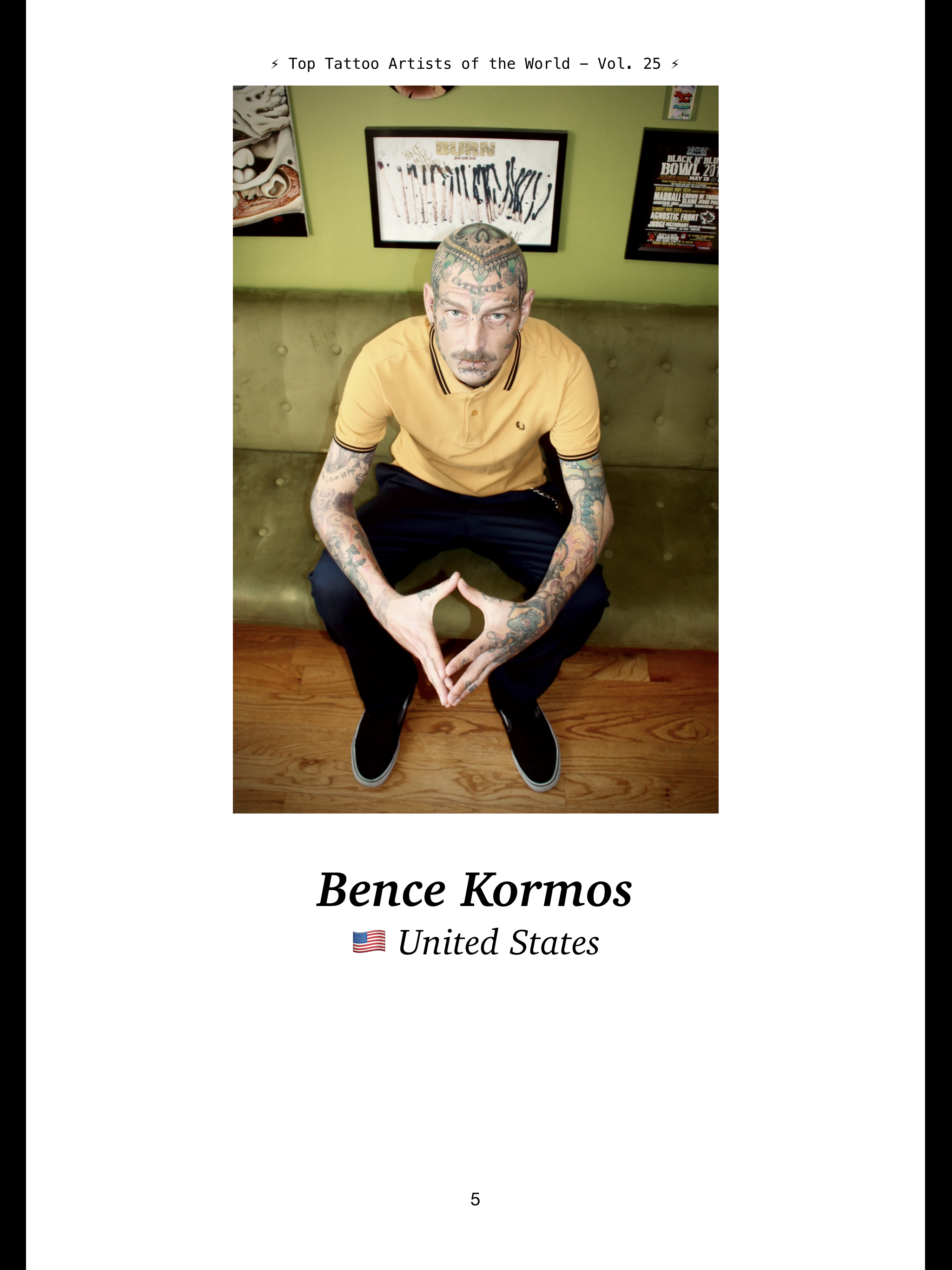 Photo of a man with tattoos sitting on a green couch in a room with Green walls and various framed posters behind him. He is wearing a yellow polo shirt and black pants, and is looking directly at the camera. The photo appears to be part of a publica