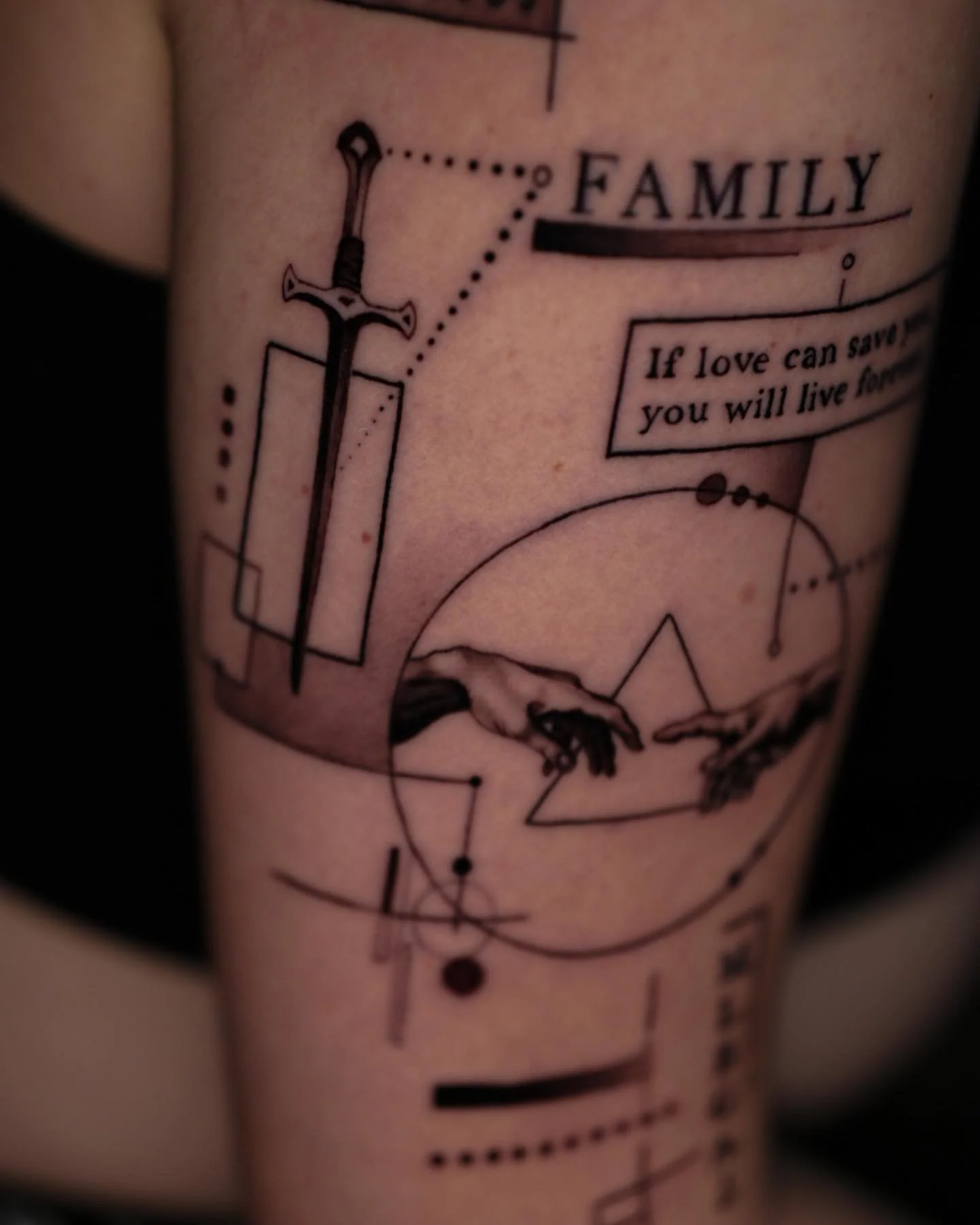 Tattoo of a compass, sword, and geometric shapes with the words 'FAMILY' and a quote that says 'If love can save you will live forever' on a person's skin.