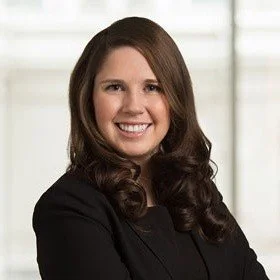 Professional headshot of Jenny Ann Urban, founder of Flying Proper LLC.