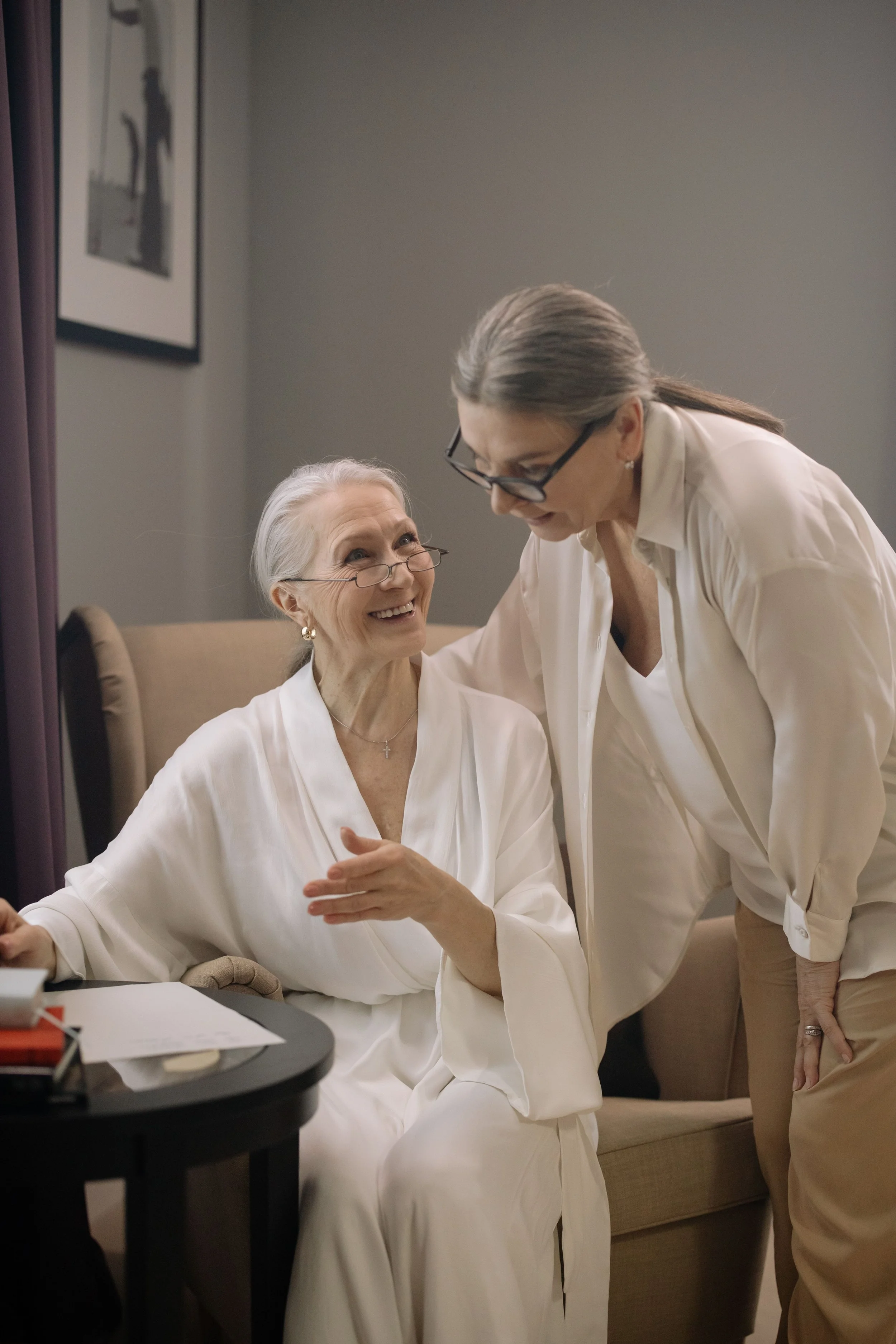 Image of a grandmother showing her written will to a person