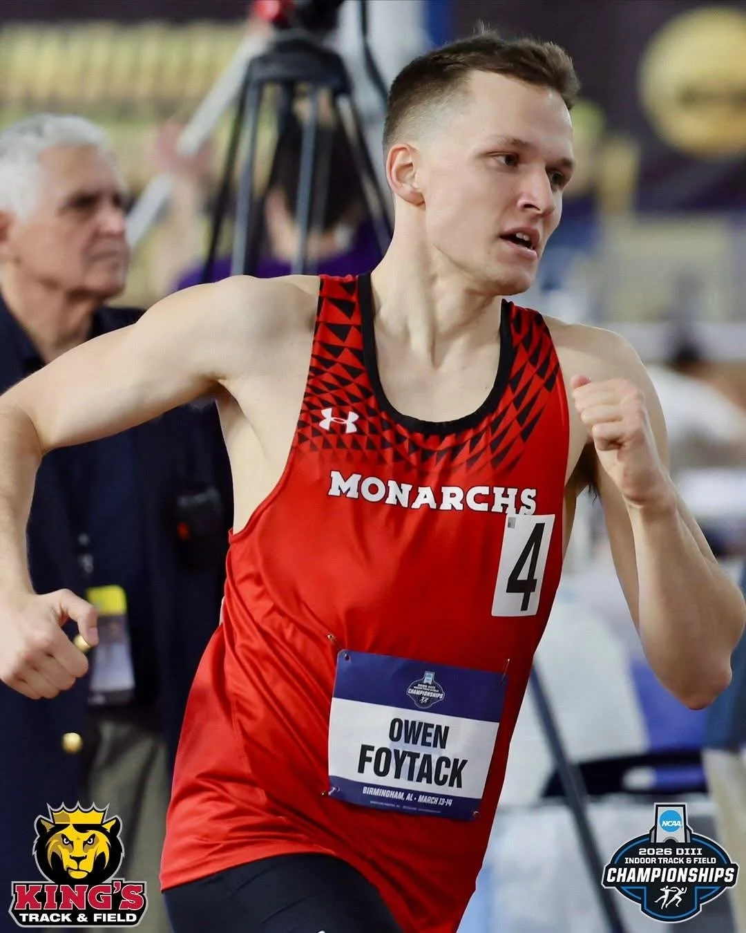 Male athlete in a red Monarchs track uniform running indoors during a track and field championship.