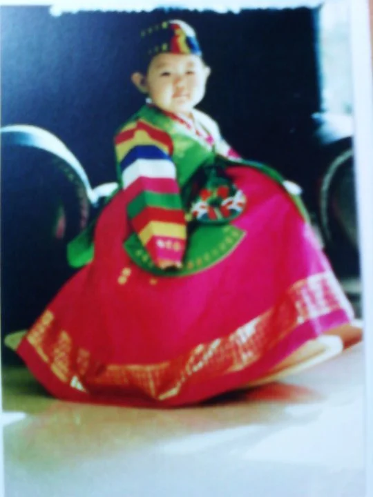 Jiggy Yoon as a child wearing a traditional Korean hanbok