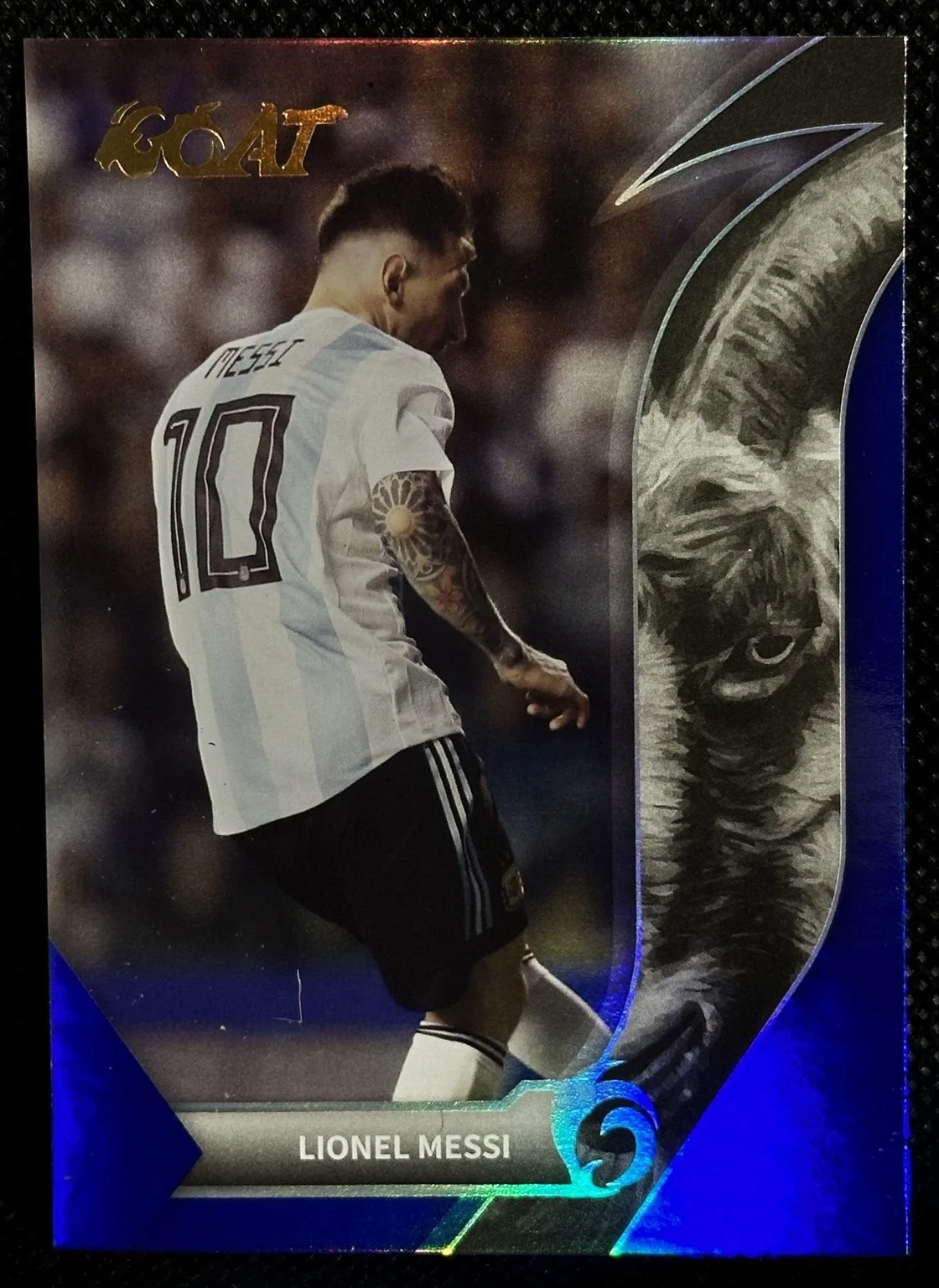 Lionel Messi Argentina number 10 GOAT soccer card with blue foil design.